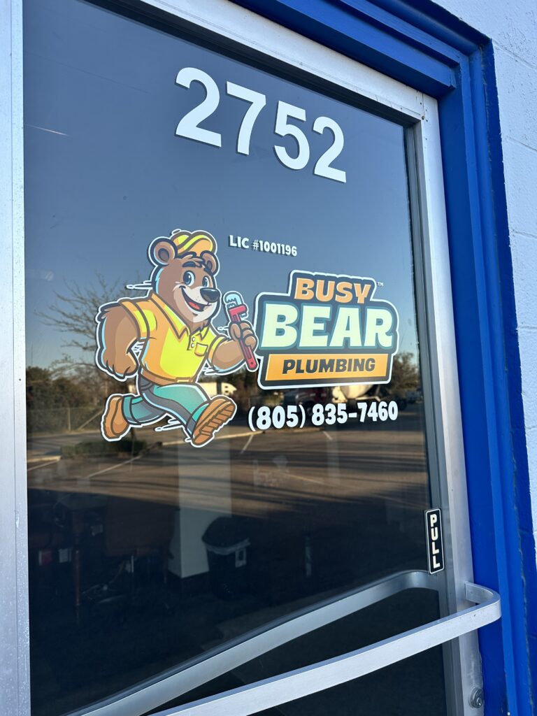Busy Bear Plumbing branded office door and company logo